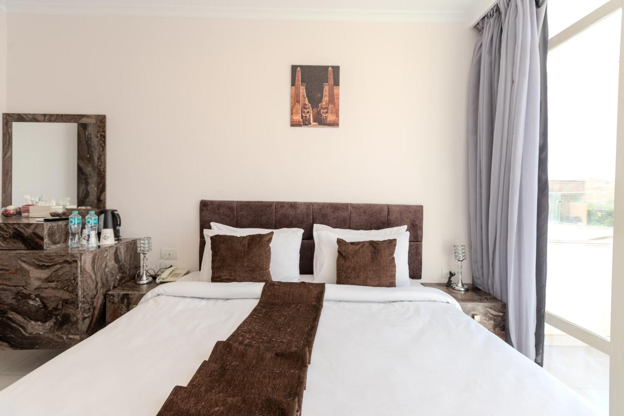 Kafret el-Gabal Shadow Pyramids Suites And Jacuzzi מראה חיצוני תמונה