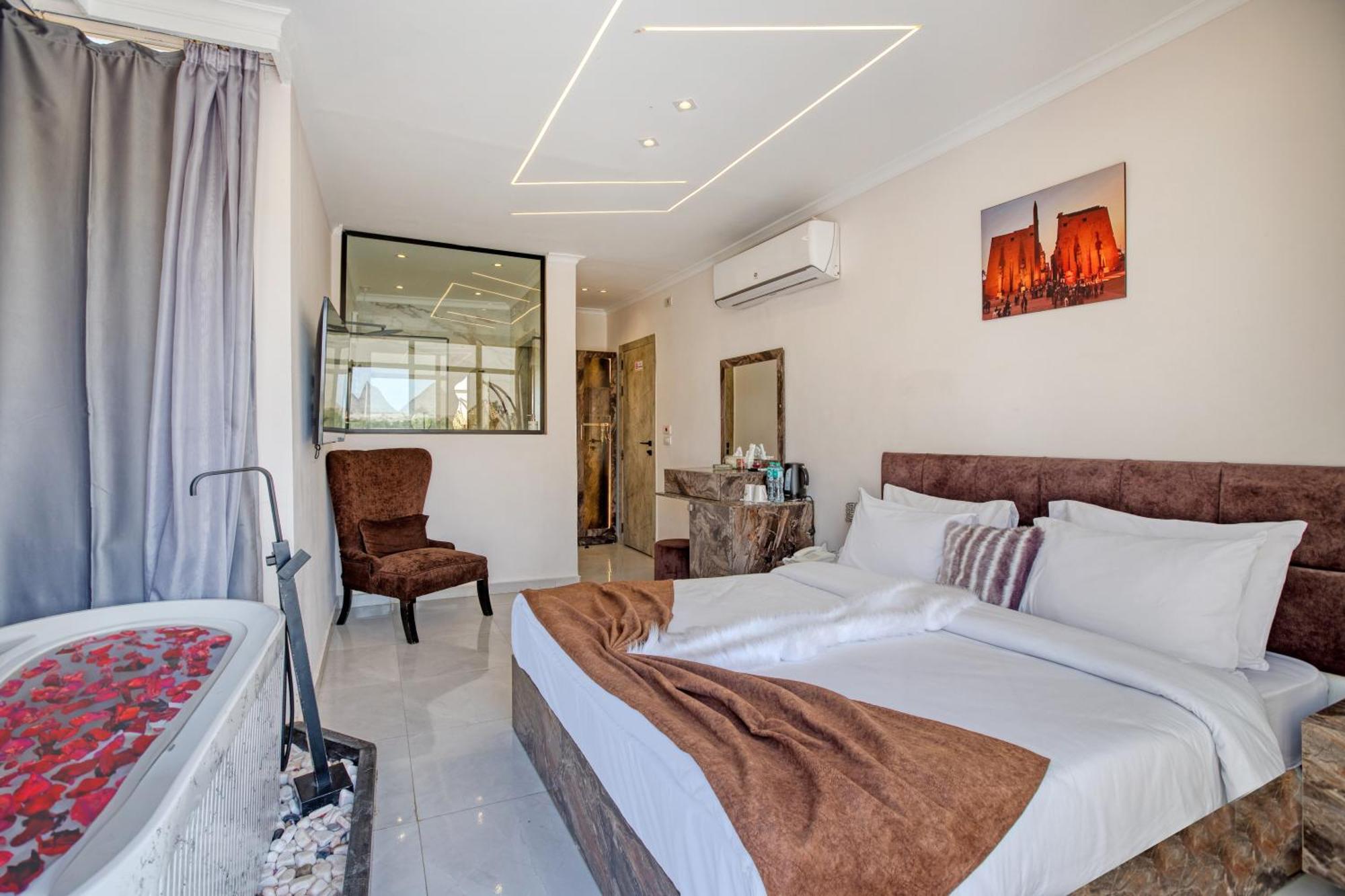 Kafret el-Gabal Shadow Pyramids Suites And Jacuzzi מראה חיצוני תמונה